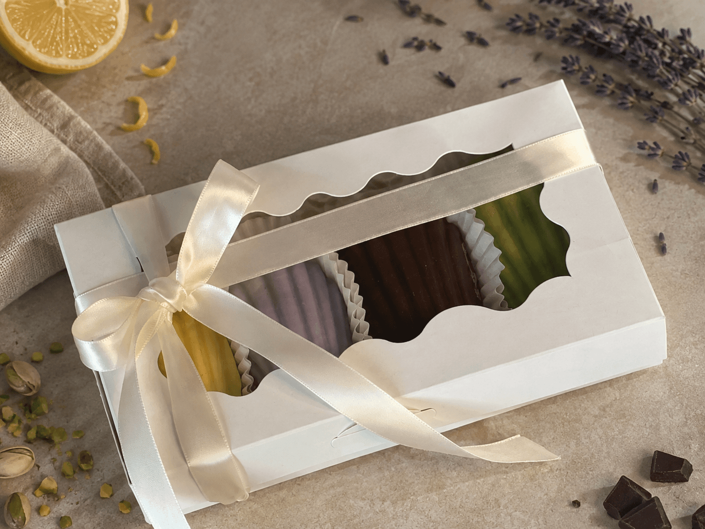 Madelia madeleine gift box tied with an ivory ribbon